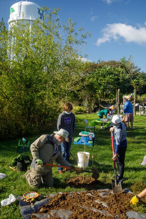 Volunteers plant a Shell Bark Hickory tree in the Kentucky Children's Garden of the Arboretum on Arbor Day.