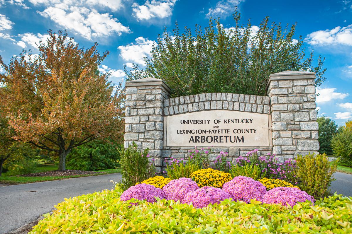 The sign and flowers at the entrance to The Arboretum, State Botanical Garden of Kentucky in Lexington, Kentucky.