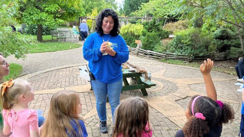 A group of children ask questions at the Kentucky Children's Garden